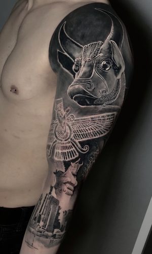 bull head of Ancient Iran sculpture black and grey surrealism tattoo